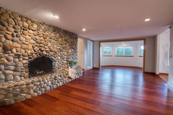 Empty room, Fireplace, Interior, Recessed Lighting, Stone Walls, Wood Texture Flooring