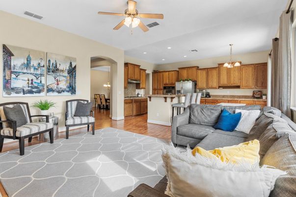 Chandelier, Dining room, Interior, Kitchen, Living room, Pendant Lights, Recessed Lighting, Stainless Steel Appliances, Wood Texture Flooring