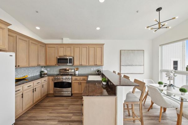 Dining room, Interior, Kitchen, Pendant Lights, Recessed Lighting, Stainless Steel Appliances, Wood Texture Flooring