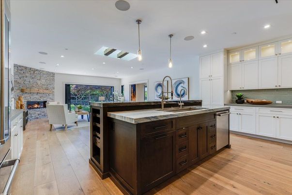 Fireplace, Interior, Kitchen, Pendant Lights, Recessed Lighting, Stainless Steel Appliances, Stone Walls, Wood Texture Flooring