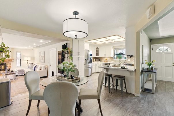 Dining room, Fireplace, Interior, Kitchen, Living room, Recessed Lighting, Stainless Steel Appliances, Wood Texture Flooring
