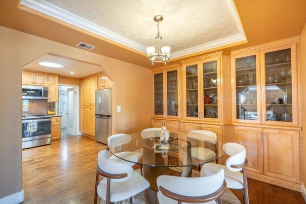 Chandelier, Dining room, Interior, Kitchen, Recessed Lighting, Stainless Steel Appliances, Wood Texture Flooring