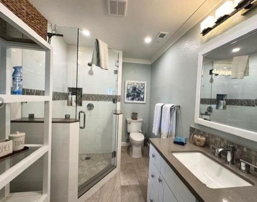 Bathroom, Dual Sink Vanities, Glass Shower, Interior, Recessed Lighting, Wood Texture Flooring
