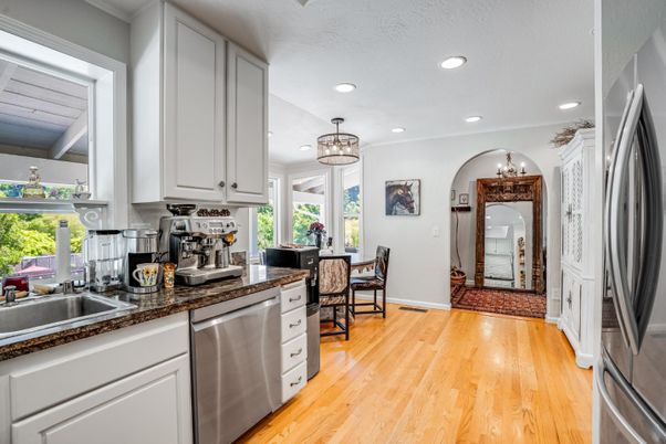Chandelier, Dining room, Interior, Kitchen, Recessed Lighting, Stainless Steel Appliances, Wood Texture Flooring
