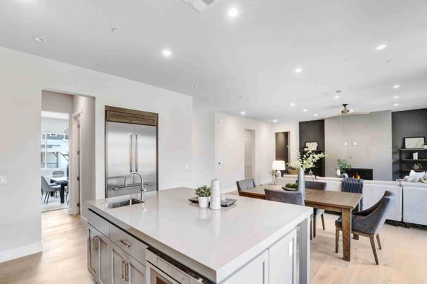 Dining room, Fireplace, Interior, Kitchen, Living room, Recessed Lighting, Stainless Steel Appliances, Wood Texture Flooring