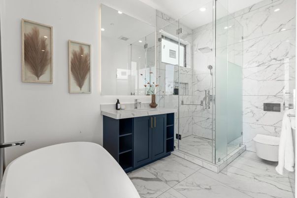 Bathroom, Dual Sink Vanities, Free Standing Baths, Glass Shower, Interior, Marble, Marble Walls, Recessed Lighting