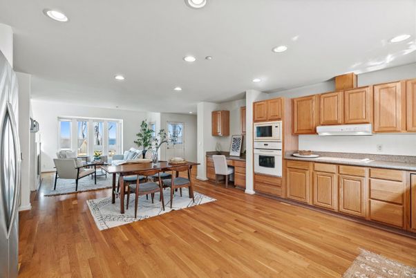 Dining room, Interior, Kitchen, Living room, Recessed Lighting, Stainless Steel Appliances, Wood Texture Flooring