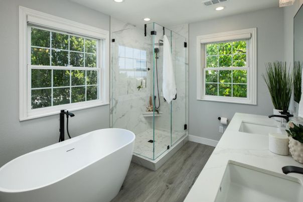 Bathroom, Dual Sink Vanities, Free Standing Baths, Glass Shower, Interior, Marble Walls, Recessed Lighting, Wood Texture Flooring