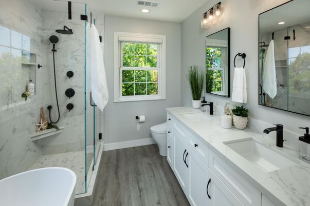 Bathroom, Dual Sink Vanities, Free Standing Baths, Glass Shower, Interior, Marble Walls, Recessed Lighting, Wood Texture Flooring