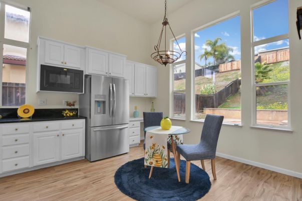 Chandelier, Dining room, Interior, Kitchen, Pendant Lights, Stainless Steel Appliances, Wood Texture Flooring