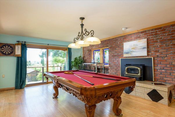 Billiard Table, Fireplace, Game Room, Interior, Pendant Lights, Stone Walls, Wood Texture Flooring