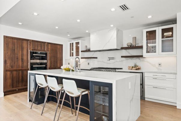 Interior, Kitchen, Marble Walls, Recessed Lighting, Stainless Steel Appliances, Wood Texture Flooring