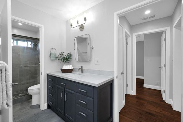 Bathroom, Dual Sink Vanities, Glass Shower, Interior, Recessed Lighting, Wood Texture Flooring