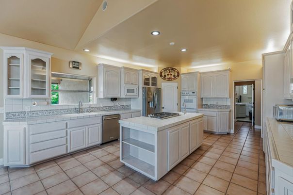 Interior, Kitchen, Recessed Lighting, Stainless Steel Appliances, Tile Countertops