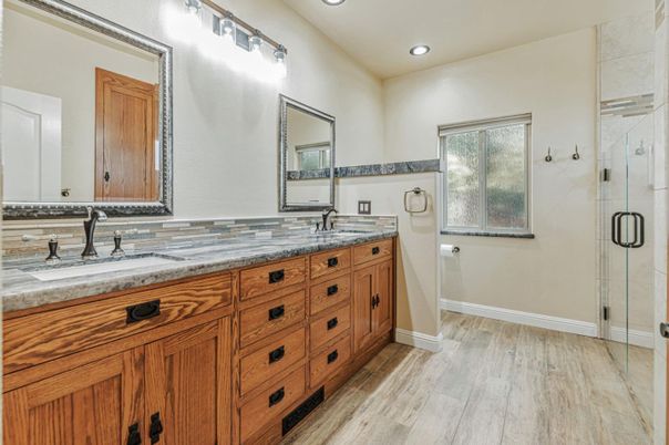 Bathroom, Dual Sink Vanities, Glass Shower, Interior, Recessed Lighting, Wood Texture Flooring