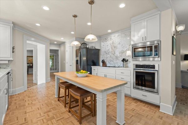 Interior, Kitchen, Marble Walls, Pendant Lights, Recessed Lighting, Stainless Steel Appliances, Wood Texture Flooring