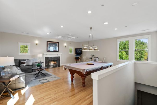 Billiard Table, Fireplace, Game Room, Interior, Living room, Pendant Lights, Recessed Lighting, Wood Texture Flooring