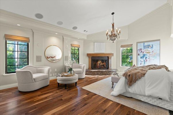 Bedroom, Chandelier, Fireplace, Interior, Living room, Recessed Lighting, Wood Texture Flooring