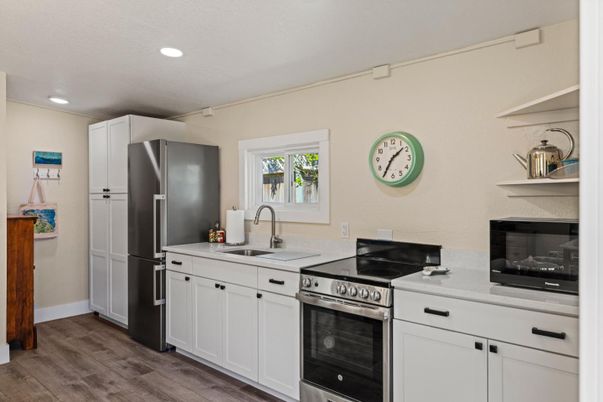 Interior, Kitchen, Recessed Lighting, Stainless Steel Appliances, Wood Texture Flooring