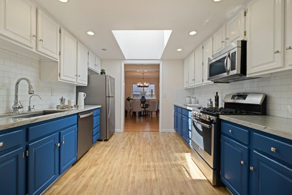 Chandelier, Dining room, Interior, Kitchen, Recessed Lighting, Stainless Steel Appliances, Wood Texture Flooring