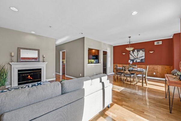 Dining room, Fireplace, Interior, Living room, Pendant Lights, Recessed Lighting, Wood Texture Flooring