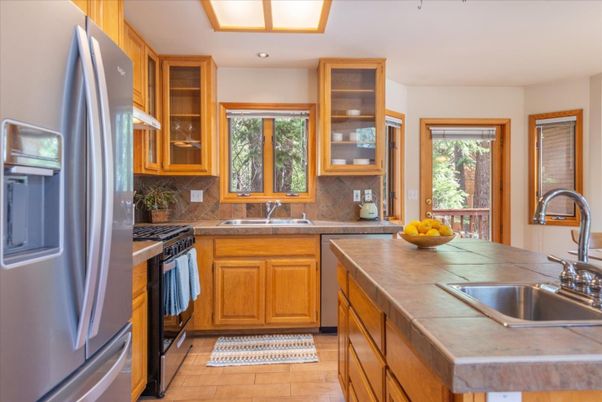 Interior, Kitchen, Recessed Lighting, Tile Countertops, Wood Texture Flooring