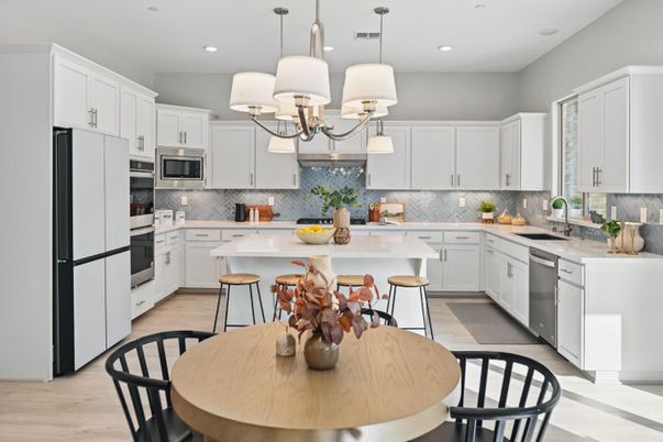 Chandelier, Dining room, Interior, Kitchen, Pendant Lights, Recessed Lighting, Stainless Steel Appliances, Wood Texture Flooring