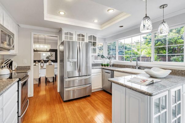 Chandelier, Dining room, Interior, Kitchen, Pendant Lights, Recessed Lighting, Stainless Steel Appliances, Wood Texture Flooring