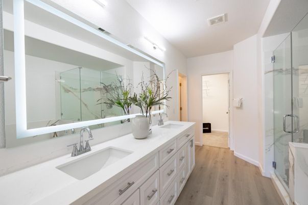 Bathroom, Dual Sink Vanities, Glass Shower, Interior, Marble Walls, Wood Texture Flooring