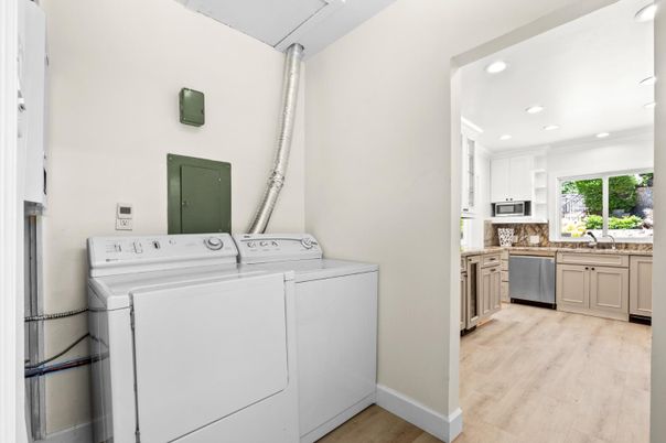Interior, Kitchen, Recessed Lighting, Washer, Wood Texture Flooring