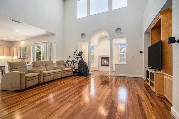 Fireplace, Fitness Equipment, Interior, Living room, Recessed Lighting, Wood Texture Flooring