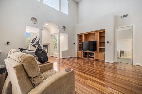 Fireplace, Fitness Equipment, Interior, Living room, Recessed Lighting, Wood Texture Flooring