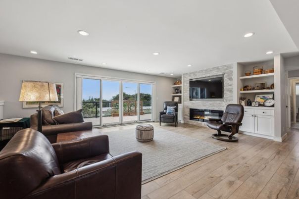 Fireplace, Interior, Living room, Recessed Lighting, Stone Walls, Wood Texture Flooring