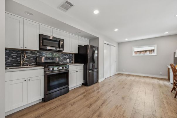 Interior, Kitchen, Recessed Lighting, Stainless Steel Appliances, Wood Texture Flooring