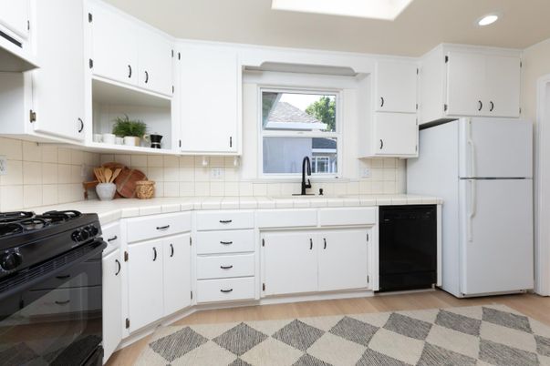 Interior, Kitchen, Recessed Lighting, Tile Countertops, Wood Texture Flooring