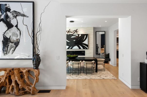 Chandelier, Dining room, Fireplace, Interior, Living room, Pendant Lights, Recessed Lighting, Wood Texture Flooring