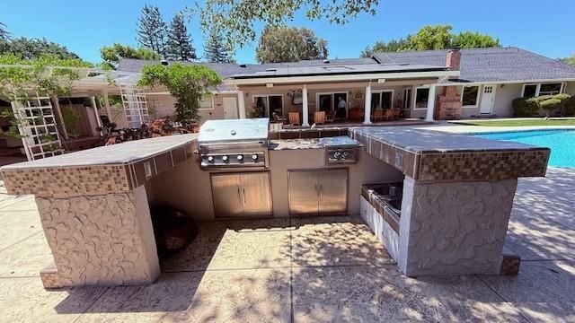 Exterior, Pool, Solar Panels