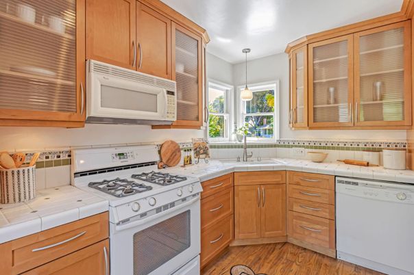 Interior, Kitchen, Pendant Lights, Tile Countertops, Wood Texture Flooring