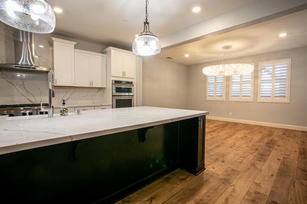 Interior, Kitchen, Marble Walls, Pendant Lights, Recessed Lighting, Stainless Steel Appliances, Wood Texture Flooring