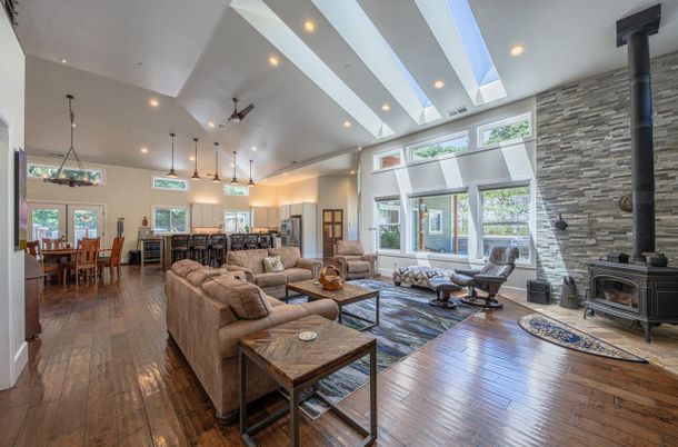 Dining room, Fireplace, Interior, Living room, Pendant Lights, Recessed Lighting, Stone Walls, Wood Texture Flooring