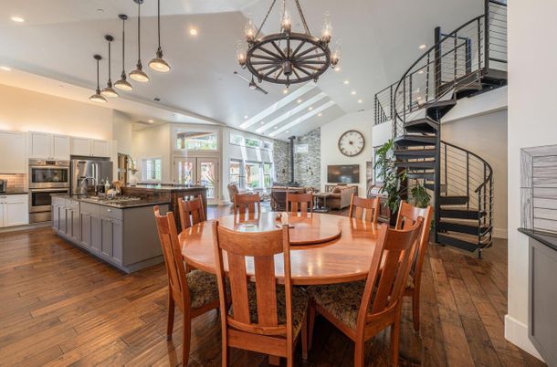 Chandelier, Dining room, Interior, Kitchen, Pendant Lights, Recessed Lighting, Stainless Steel Appliances, Wood Texture Flooring