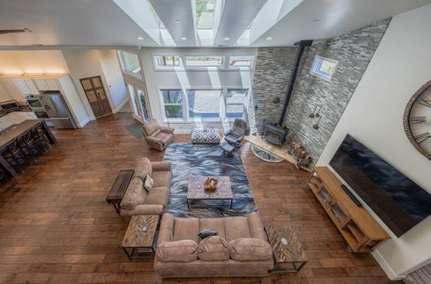 Fireplace, Interior, Living room, Recessed Lighting, Stone Walls, Wood Texture Flooring