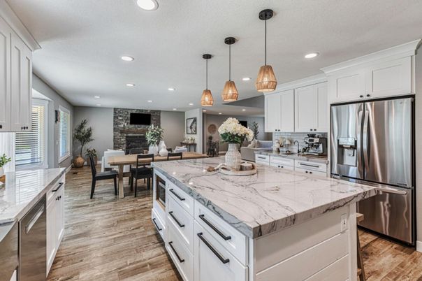 Dining room, Fireplace, Interior, Kitchen, Living room, Pendant Lights, Recessed Lighting, Stainless Steel Appliances, Stone Walls, Wood Texture Flooring