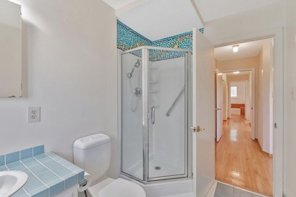 Bathroom, Glass Shower, Interior, Tile Countertops, Wood Texture Flooring