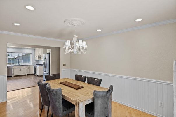 Chandelier, Dining room, Interior, Kitchen, Recessed Lighting, Stainless Steel Appliances, Wood Texture Flooring