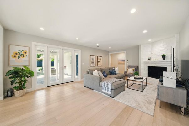 Fireplace, Interior, Living room, Recessed Lighting, Stone Walls, Wood Texture Flooring