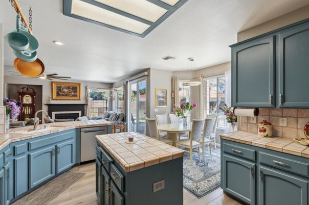 Dining room, Fireplace, Interior, Kitchen, Pendant Lights, Recessed Lighting, Tile Countertops, Wood Texture Flooring