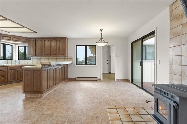 Fireplace, Interior, Kitchen, Pendant Lights, Tile Countertops