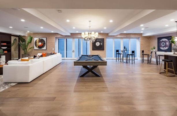 Billiard Table, Chandelier, Game Room, Interior, Living room, Recessed Lighting, Stone Walls, Wood Texture Flooring