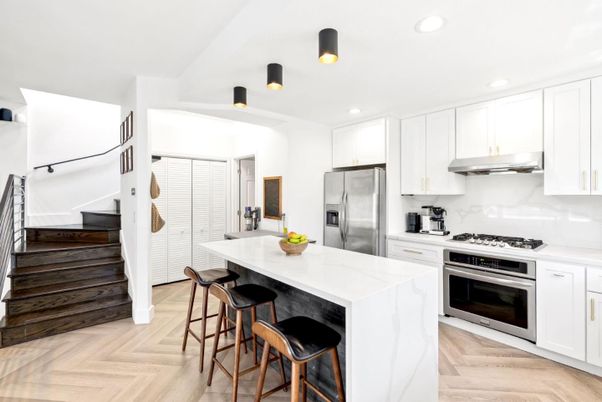 Interior, Kitchen, Marble Walls, Recessed Lighting, Stainless Steel Appliances, Wood Texture Flooring